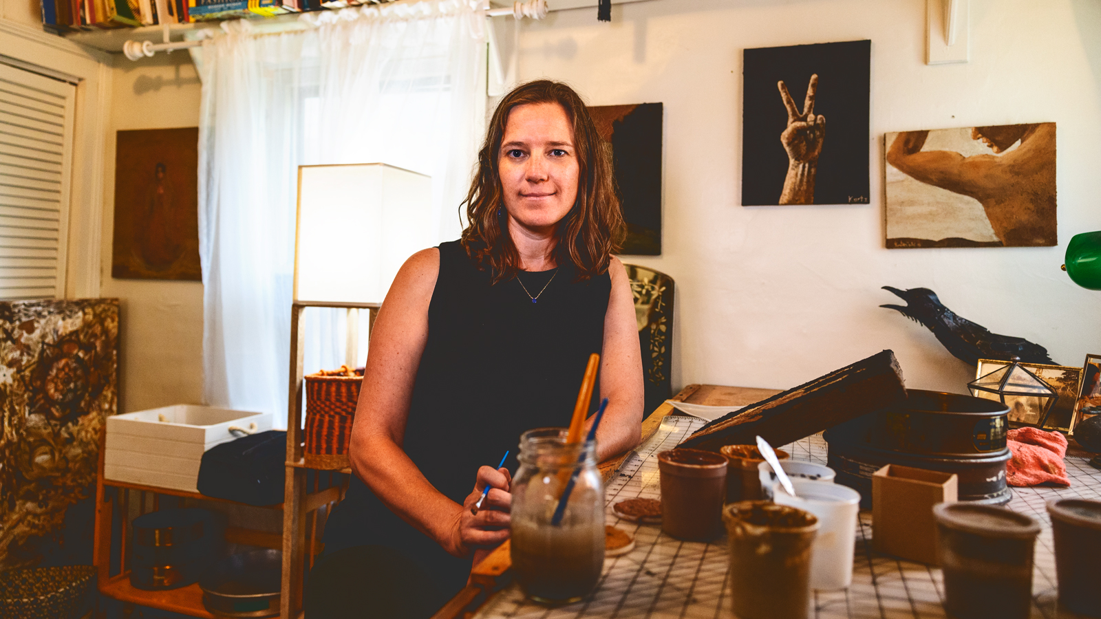 Kirsten Kurtz, MS ’21, manager of Cornell’s Soil Health Lab and a soil artist, pictured in her home studio