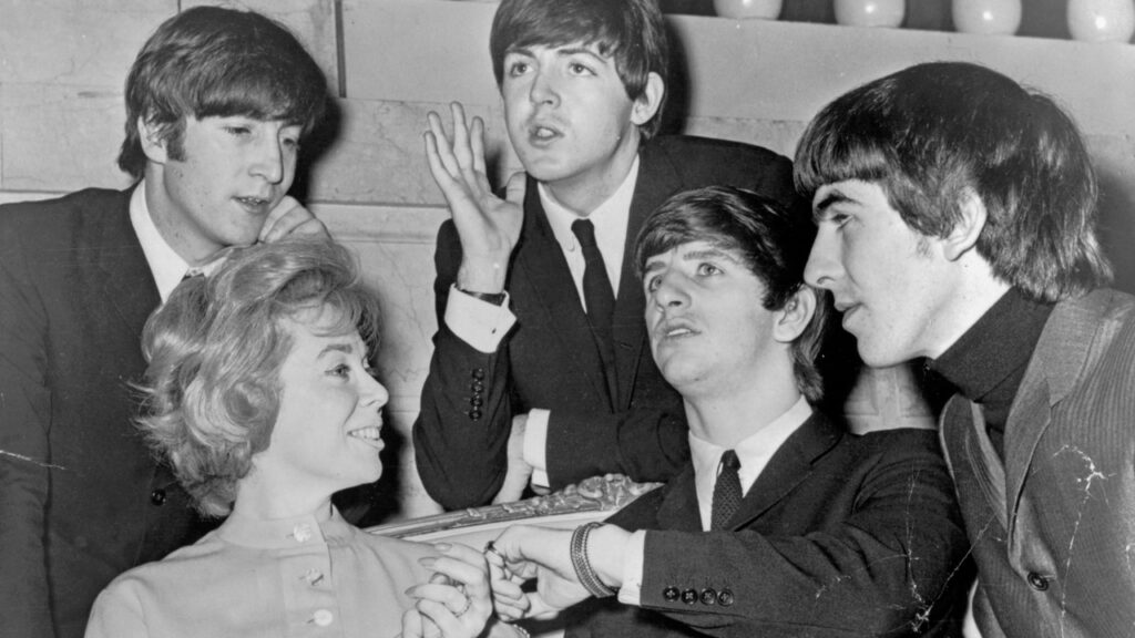 Dr. Joyce Brothers interviews The Beatles for the Journal American, ahead of the band’s first U.S. concert on Feb. 11, 1964