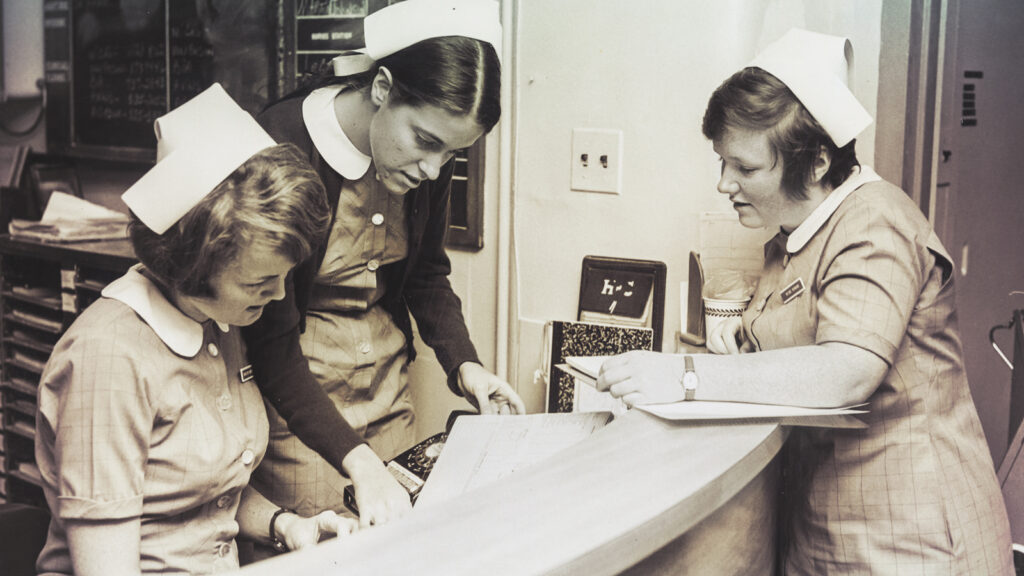 Students at work at a nurses' station at a hospital, 1970