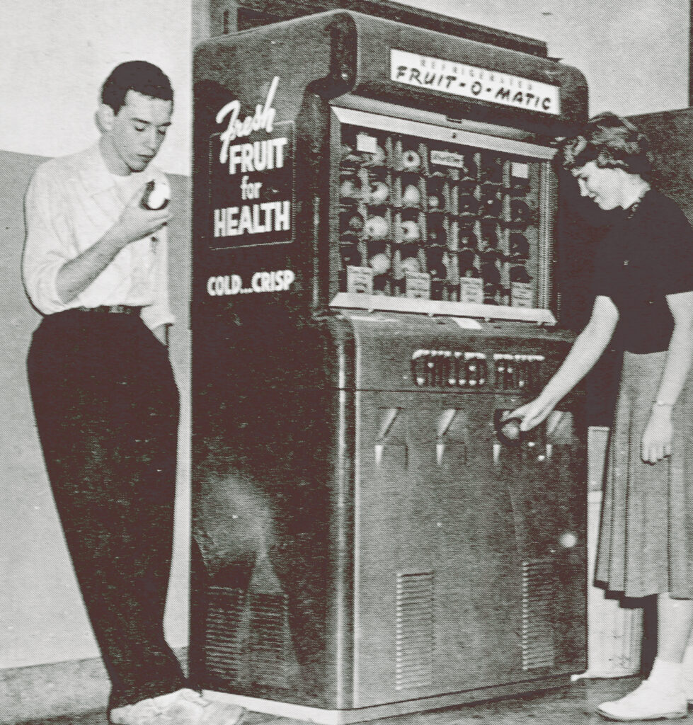 Photo shows the "Fruit-o-Matic" vending machine in the Plant Sciences Building in the 1950s