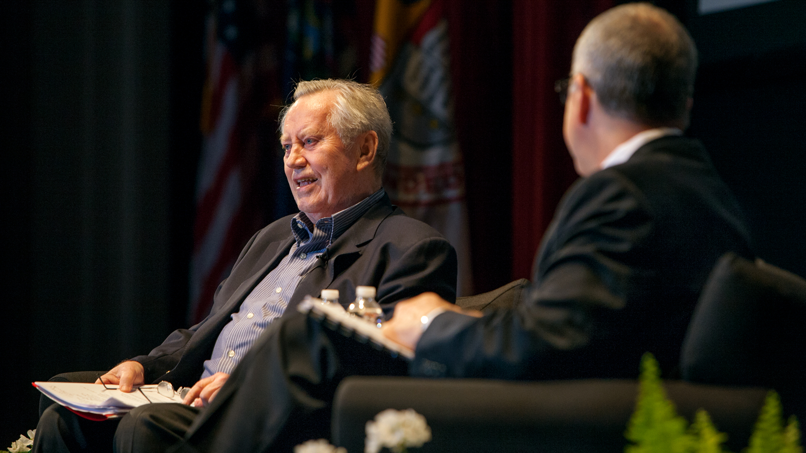 Chuck Feeney chats with then-President David Skorton at the Olin Lecture in 2011