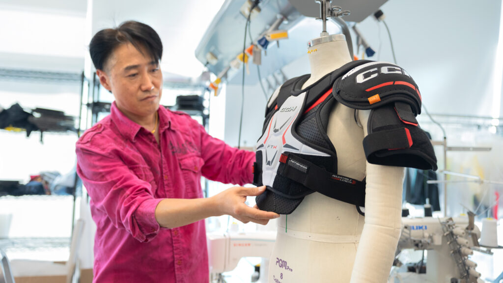 Heeju Terry Park , Associate Professor in the Department of Fiber Science & Apparel Design at Cornell University, pictured assessing industry standard hockey protective equipment in his lab in the Human Ecology building.