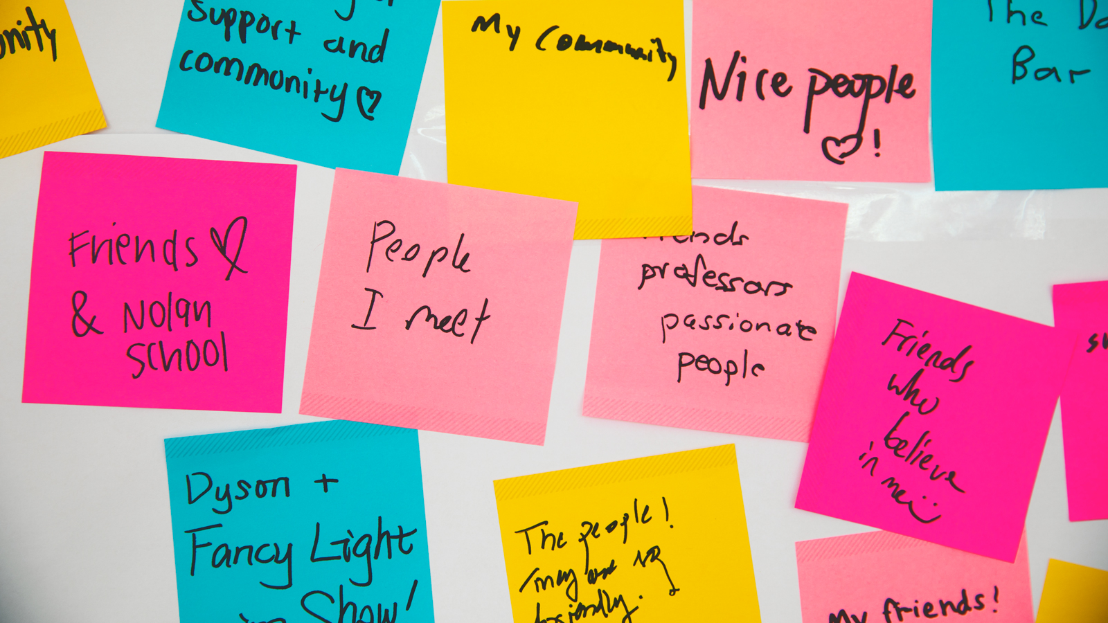 Image of multiple Post-It notes, some of which say: my community; nice people; friends & Nolan School; people I meet; friends, professors, passionate people; friends who believe in me; Dyson + fancy light show; and my friends!