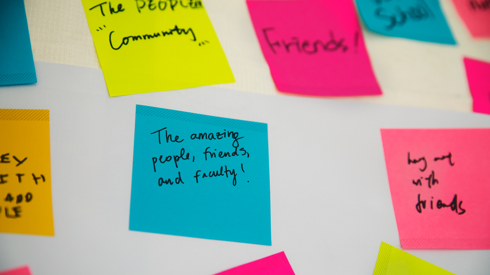 Image of multiple Post-It notes, some of which say: the people and community; friends!; the amazing people, friends, and faculty!; and hang out with friends.