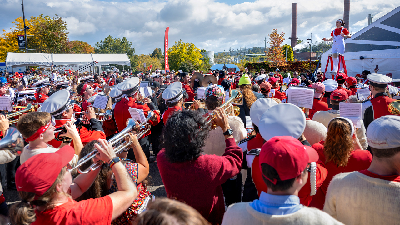 A raucous Big Red Band performance electrifies the Crescent Lot next to Schoellkopf before the football game