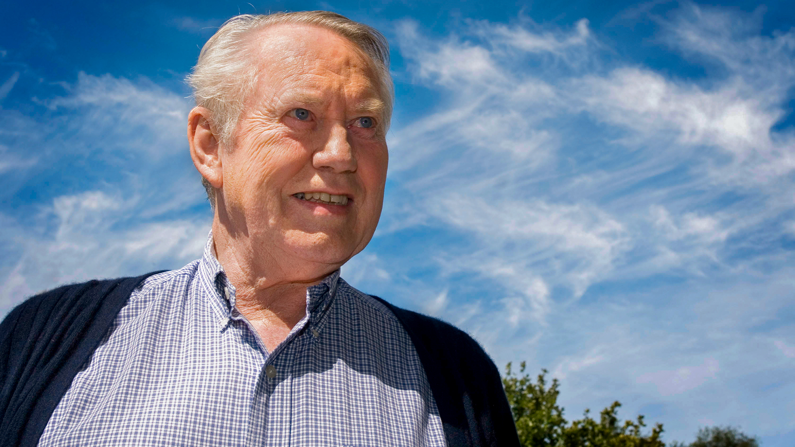 Chuck Feeney pictured against a blue sky