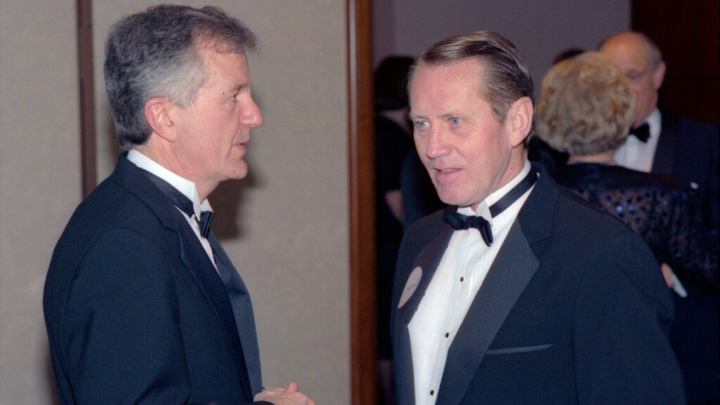 Feeney, right, with Jack Clark, dean of what was then the School of Hotel Administration, during Hotel Ezra Cornell in 1989