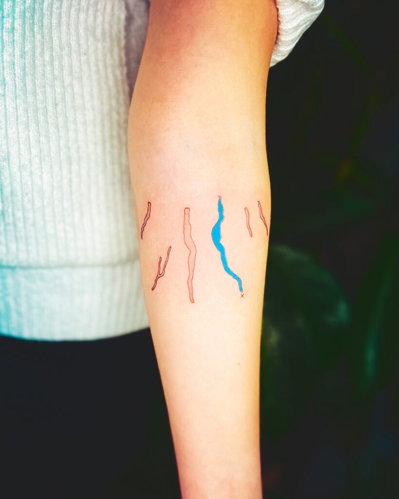 A tattoo of the Finger Lakes with Lake Cayuga colored blue