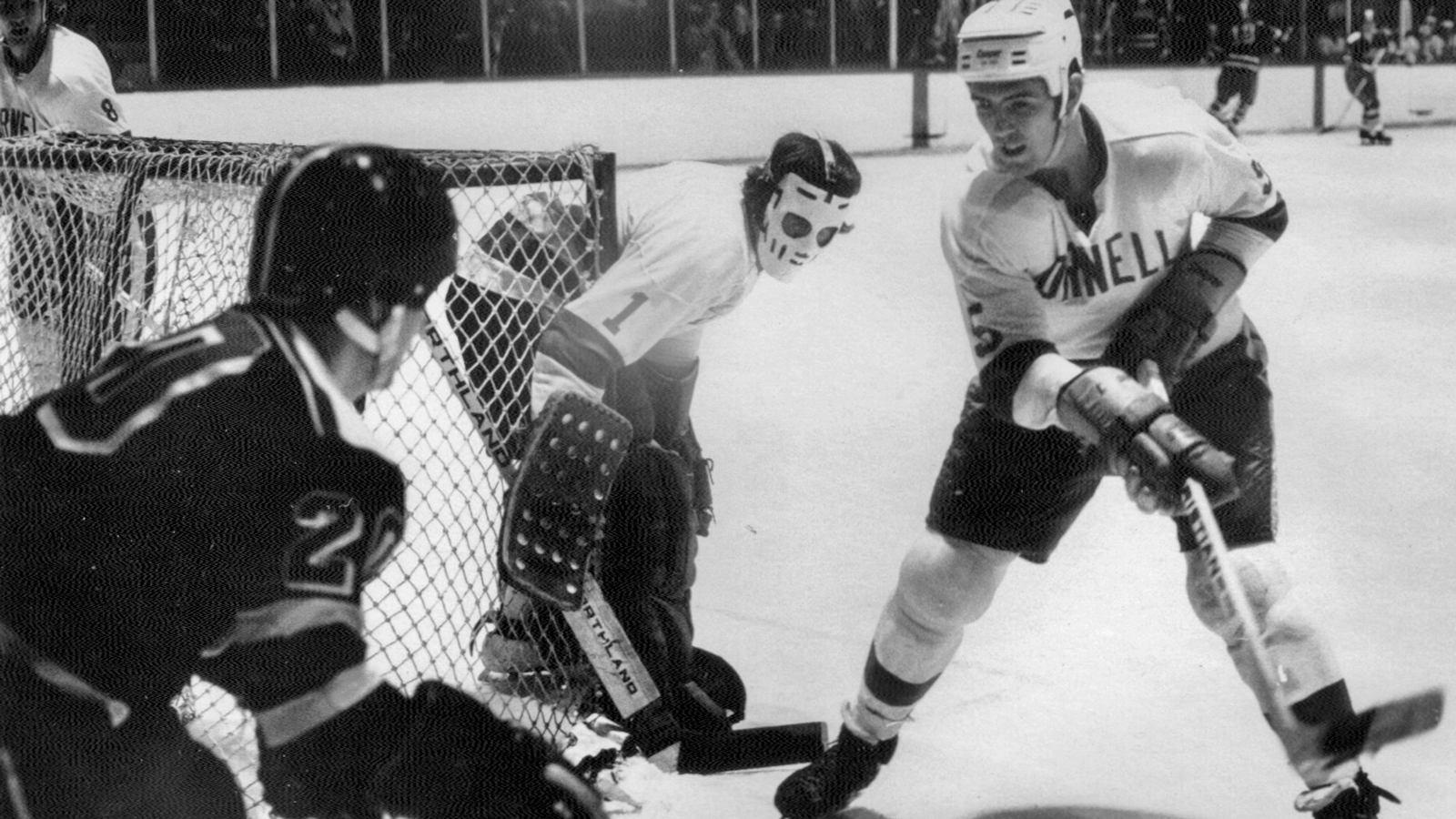Big Red Hockey action more than a half century ago—complete with the Jason-like goalie mask common at the time