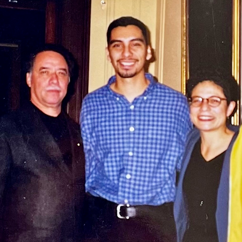 Manuel Muñoz, center, at the A.D. White House in 1996 with Helena Viramontes, right, and her husband, now-retired professor Eloy Rodriguez, at left