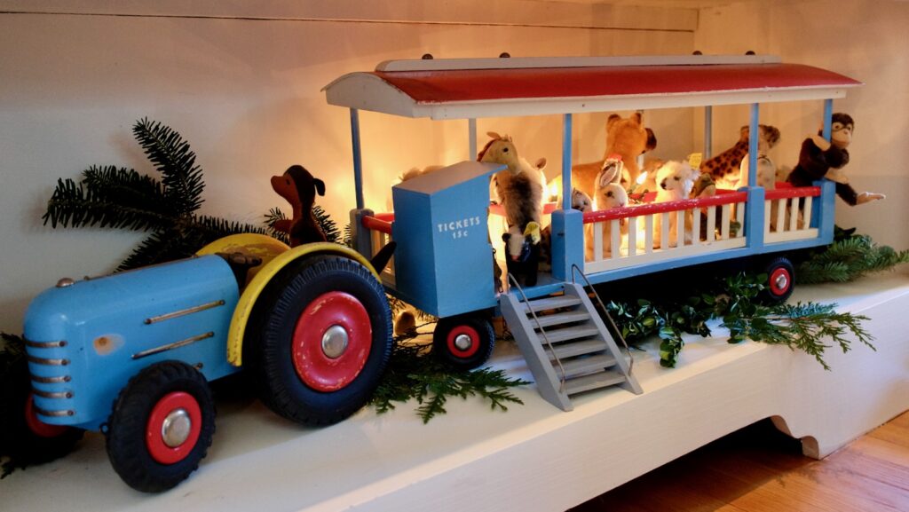 vintage tractor toy with small stuffed animals and lights
