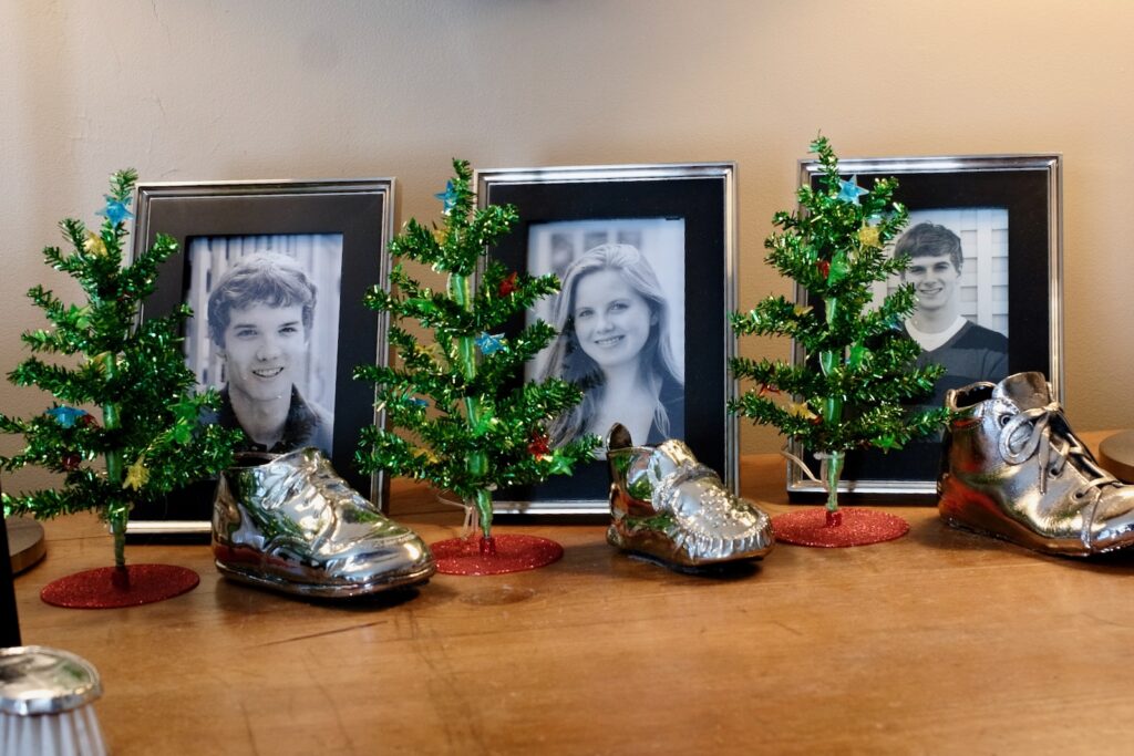 small model trees interspersed with family photos