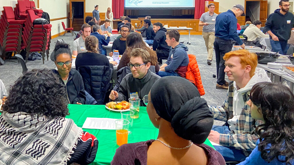 Students at an interfaith dinner in Anabel Taylor Hall