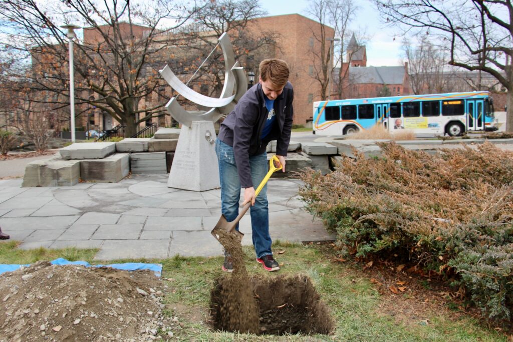 Eric Simeonoglou ’15, MEng ’16 buries a time capsule on the Engineering Quad in 2015