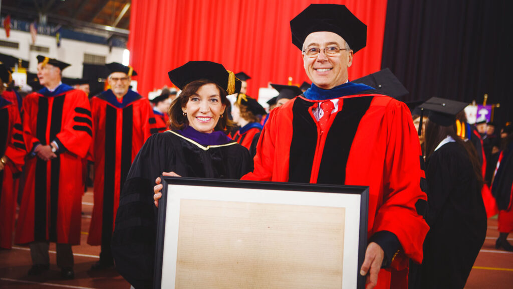 New York State Gov. (then Lt. Gov.) Kathy Hochul poses with Ezra and the Cornell University Charter during Charter Day Sesquicentennial celebrations in April 2015.