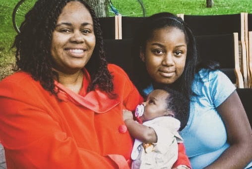 Michelle Brown-Grant ’88 and Misha Inniss-Thompson ’16 in 2006, with Michelle holding baby Tyree