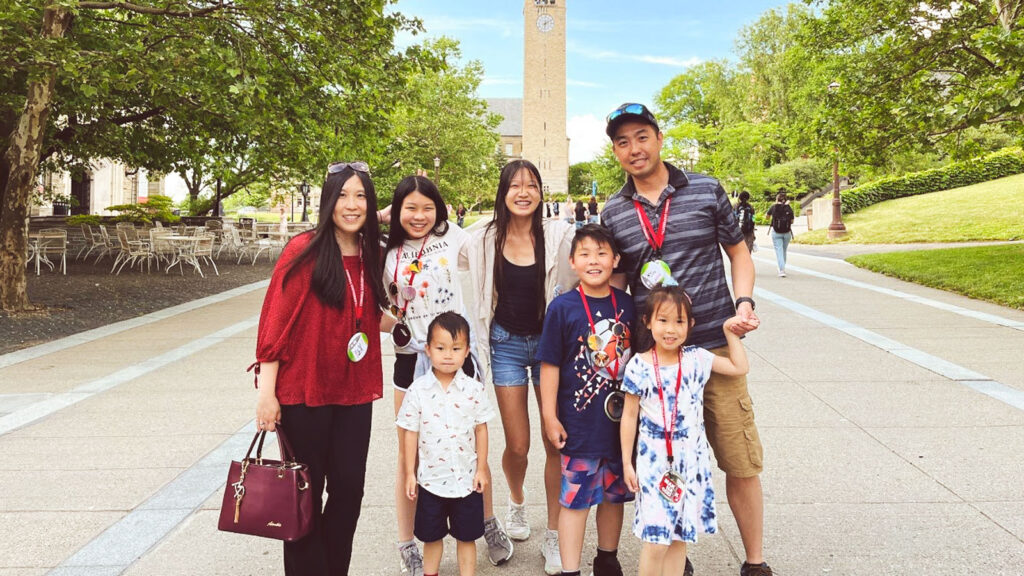 Janet Tang Wong ’02, MEng ’03 and Peter Wong ’02, MEng ’03 with their five children on campus for their 20th reunion