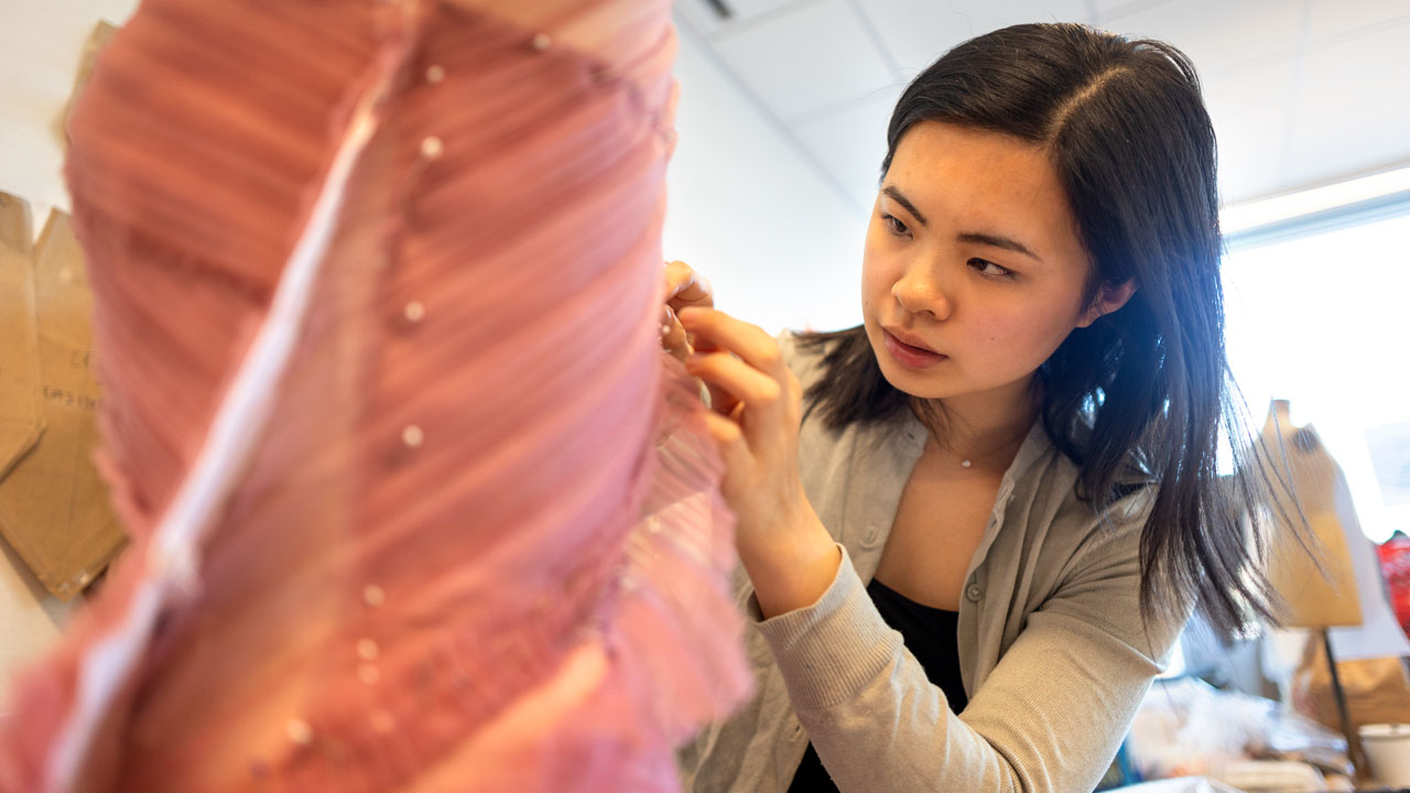 Angela Lan, Fashion Design '24, works on her line for the 2024 CFC Fashion show in the Human Ecology building design studios. Angela is the Director of Design 3/4 on the 2024 CFC Executive Board.