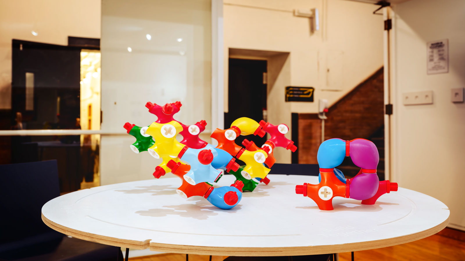 Small, brightly colored, toy-like sculptures from the work "The Civic Playground Project"