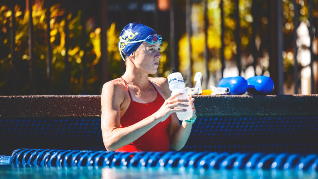 Taylor Knibb takes a hydration break in the pool in Hawaii in October 2023