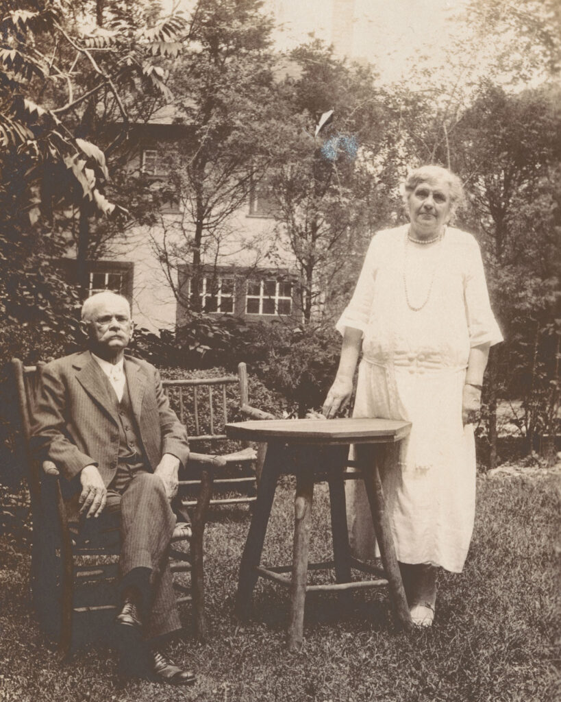 John and Anna Botsford Comstock in their garden in Ithaca