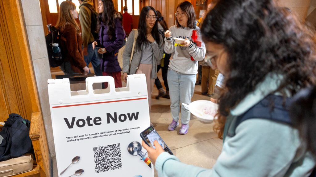 A student snaps a QR code during Freedom of Expression ice cream voting in Willard Straight Hall