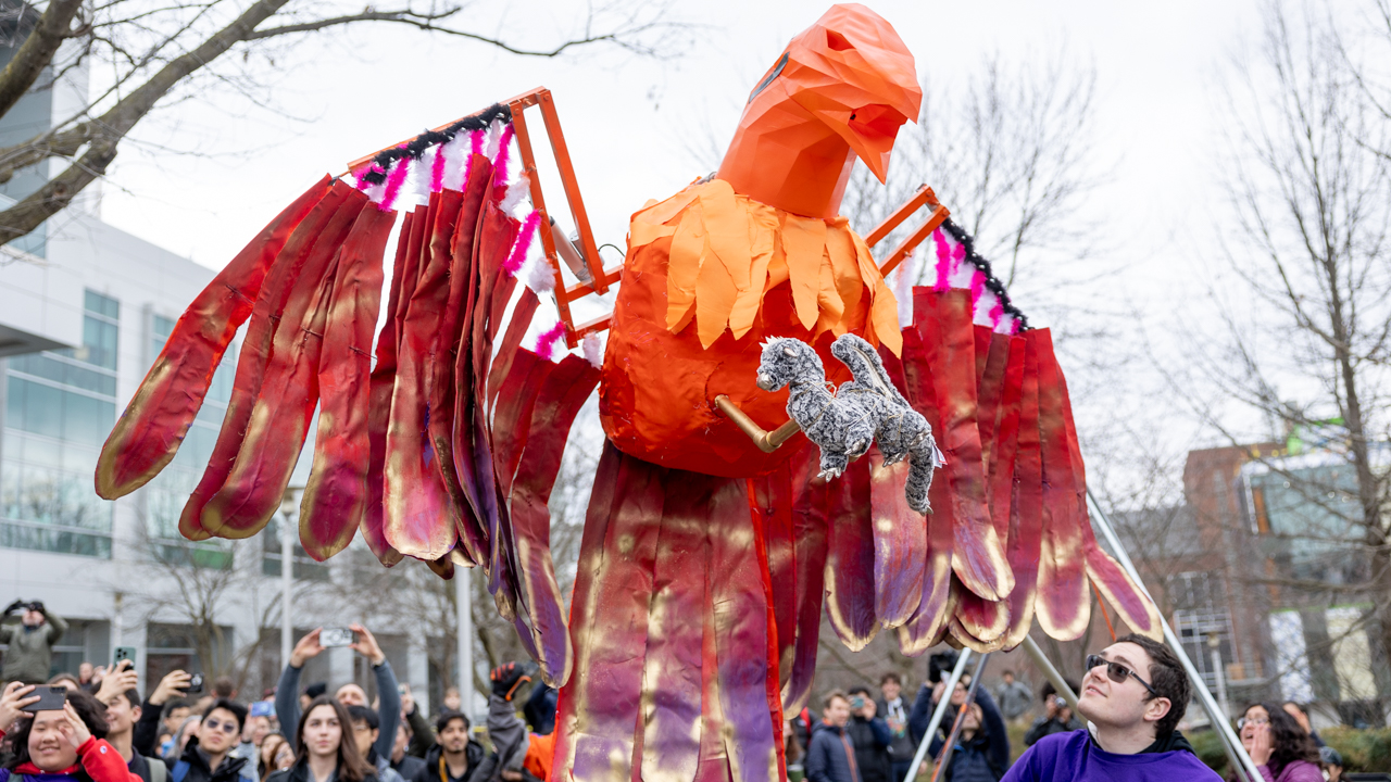 The phoenix—holding a small stuffed dragon—rise on the Engineering Quad