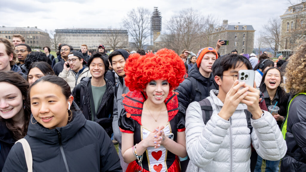 Parade-goers enjoy the spectacle in the heart of campus