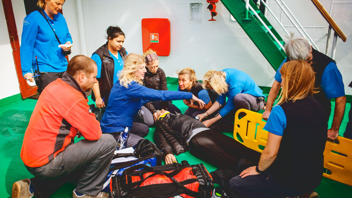 Dr. Rebecca Smith-Coggins conducting an emergency medicine drill aboard a ship