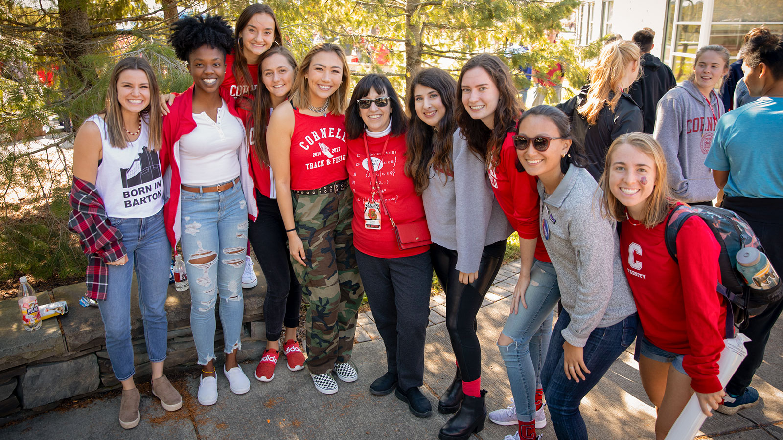 President Martha Pollack poses with students and alumni during Homecoming 2019