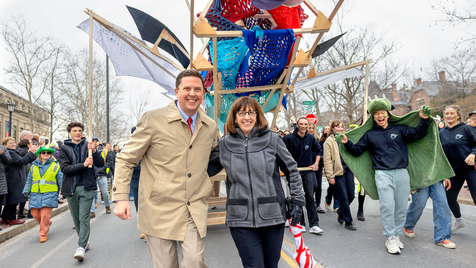 Ryan Lombardi, vice president for student and campus life, and President Martha Pollack march in the Dragon Day parade in 2023