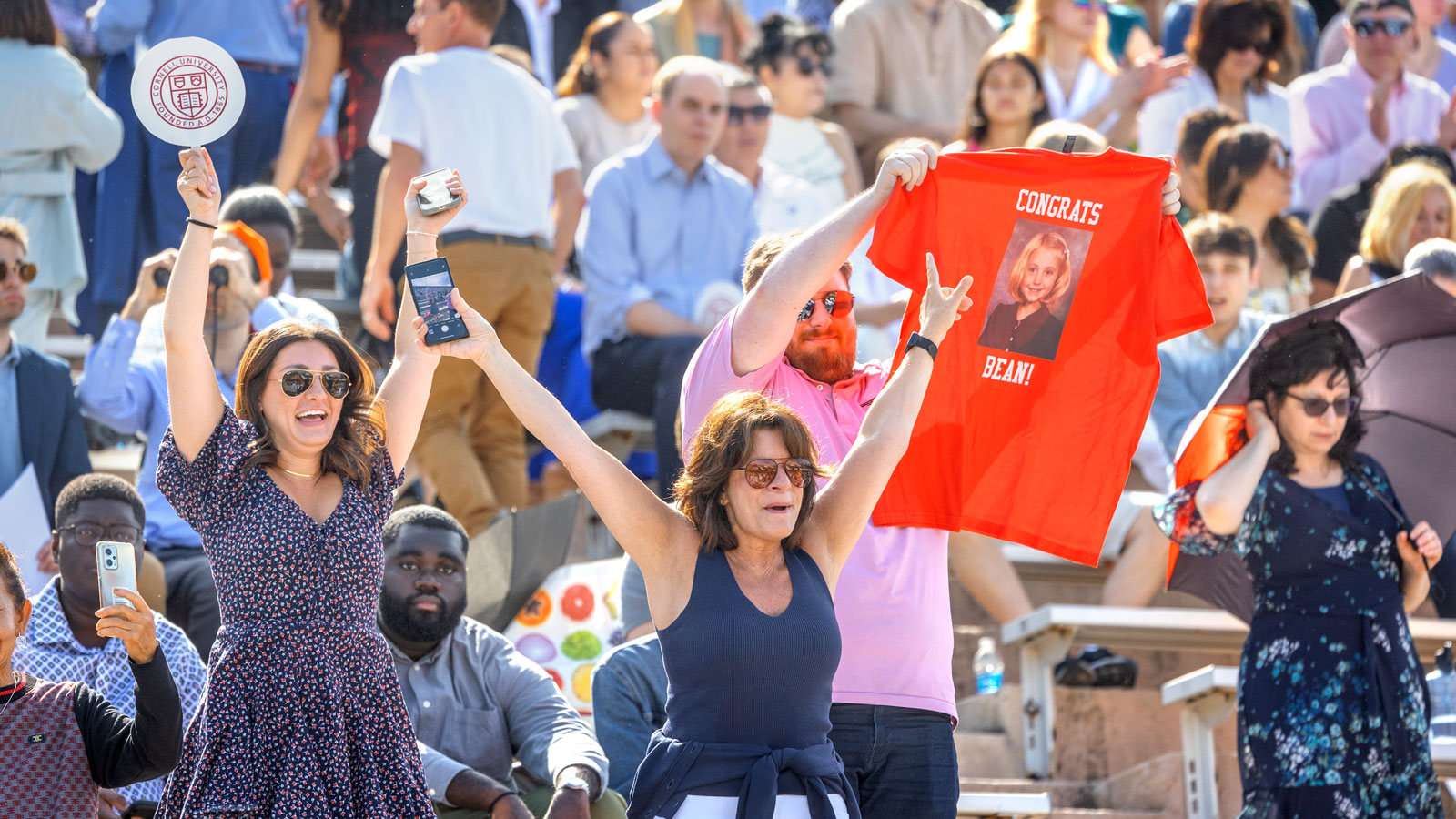 Family members cheer for a graduating senior at Schoellkopf Stadium during Commencement 2024