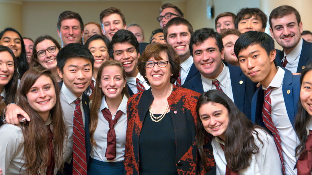 Martha Pollack poses with students in 2016 on the day she was announced as Cornell’s 14th president.