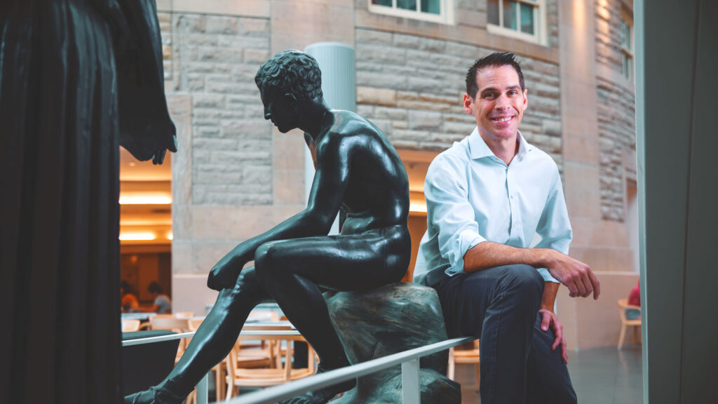 Classics professor Mike Fontaine poses in Klarman Hall