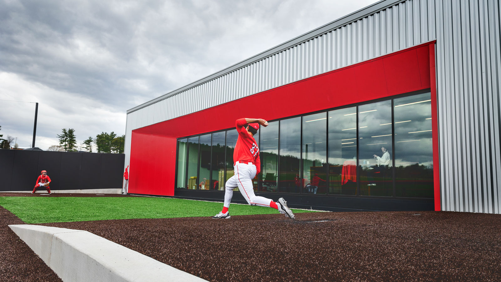 A pitcher warms up in the bullpen during a Big Red men‘s baseball game in April 2024 at Booth Field