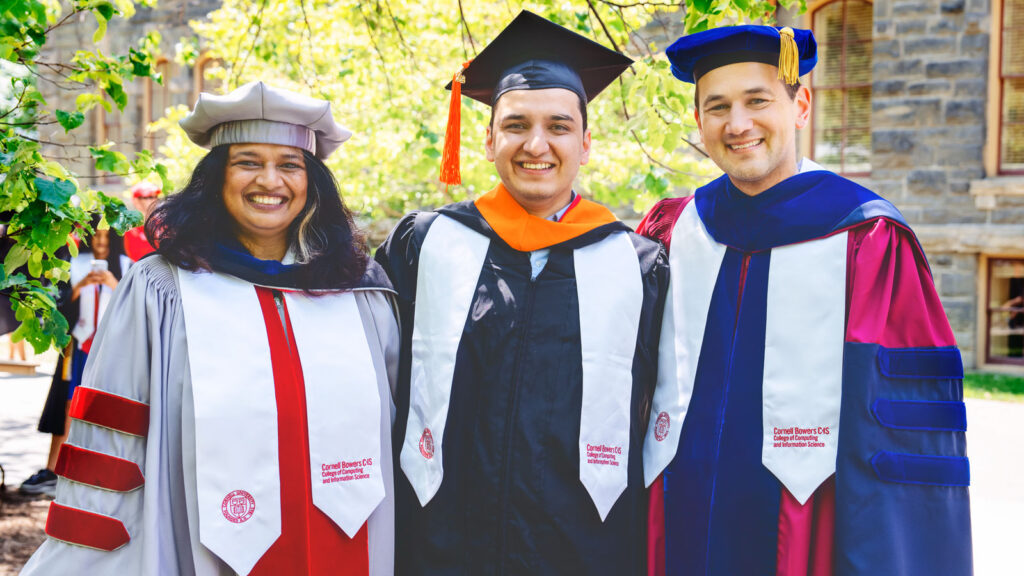 Hussain Ahmad Mohammed (center) with Kavita Bala, dean of the Cornell Ann S. Bowers College of Computing and Information Science (left), and Nate Foster, professor of computer science (right) at Cornell’s 2023 Commencement