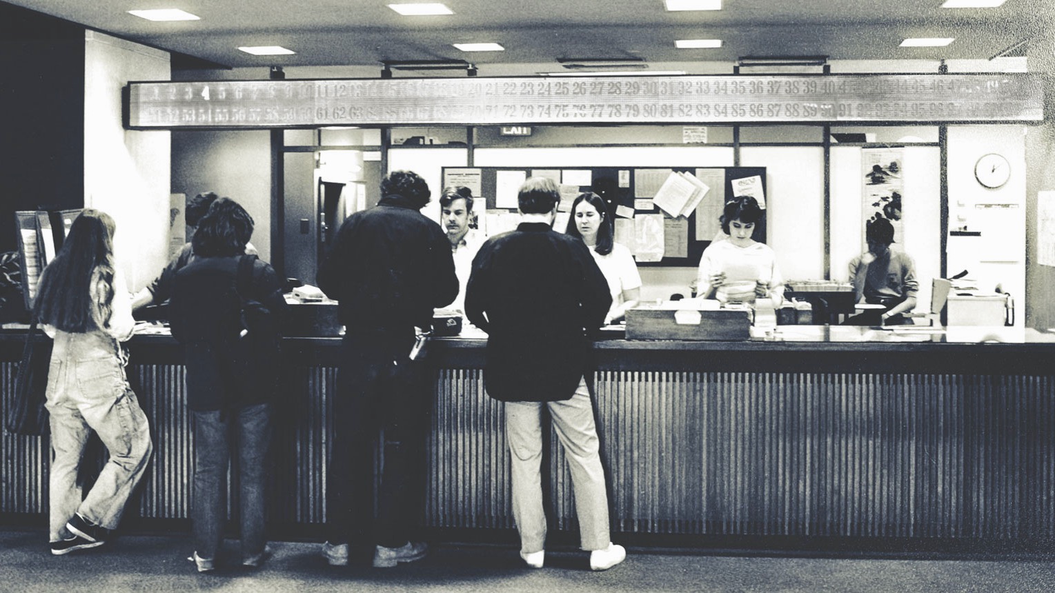 Patrons at the Olin circulation desk in 1972