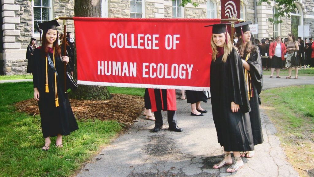Leslie Sonis Sachs at Cornell’s 2009 Commencement with the College of Human Ecology banner