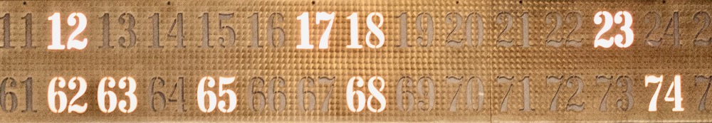 detail view of the Olin paging numbers sign with several numerals lit