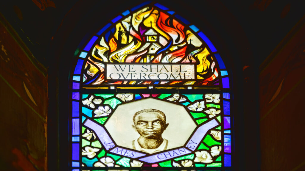 detail view of the stained-glass window in Sage Chapel in memory of the three civil rights workers killed in 1964