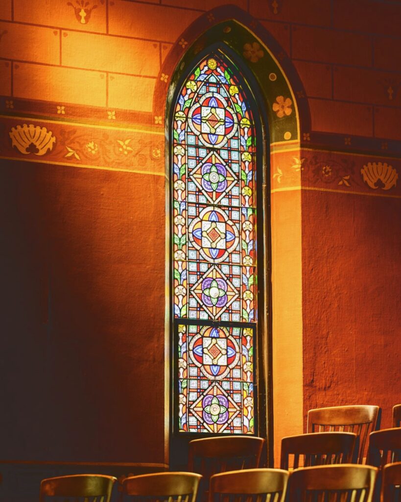 view of a stained-glass window in Sage Chapel