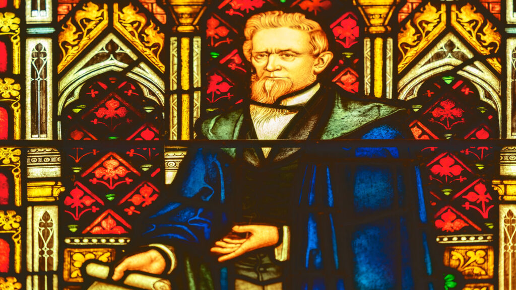 Ezra Cornell, pictured above his tomb in a stained-glass window in Sage Chapel