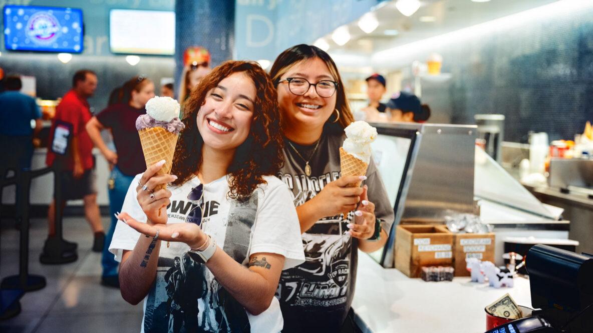 Students smile with ice cream cones at the Dairy Bar