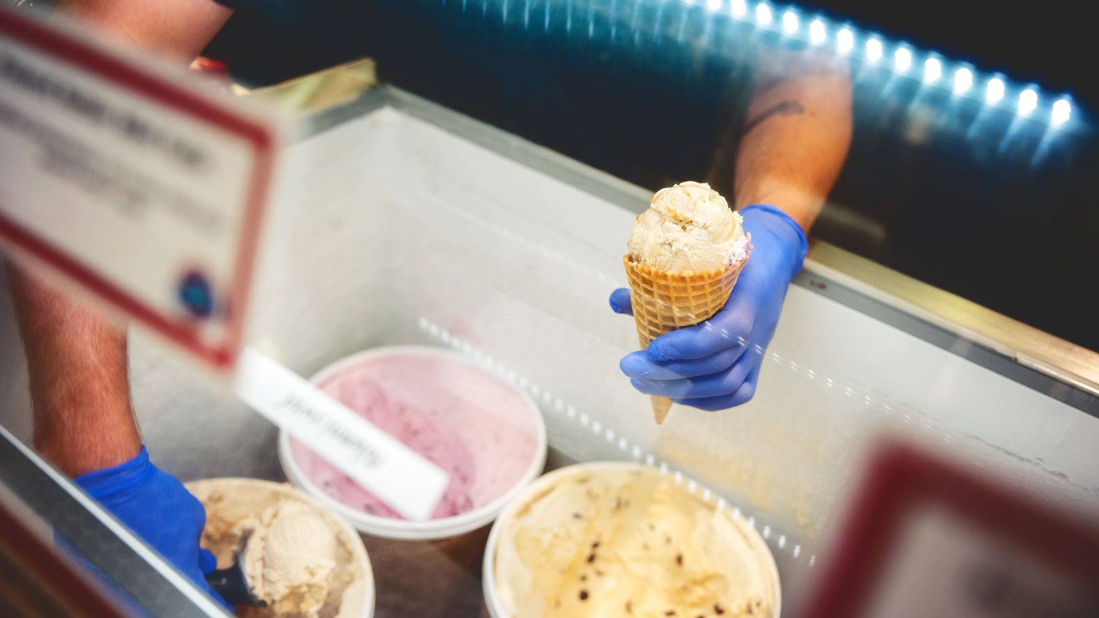Ice cream being scooped from behind the ice cream counter at the Dairy Bar.