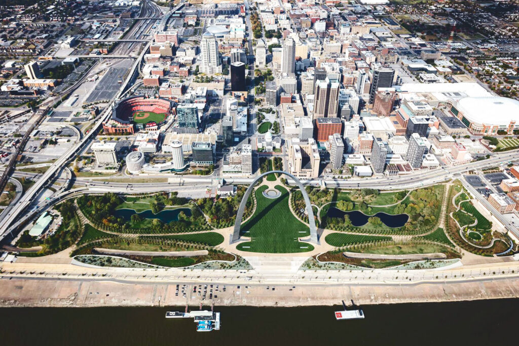 Aerial view of The famed 630-foot-tall Gateway Arch in St. Louis, MO and the surrounding parkland that now connects the landmark to the rest of the city