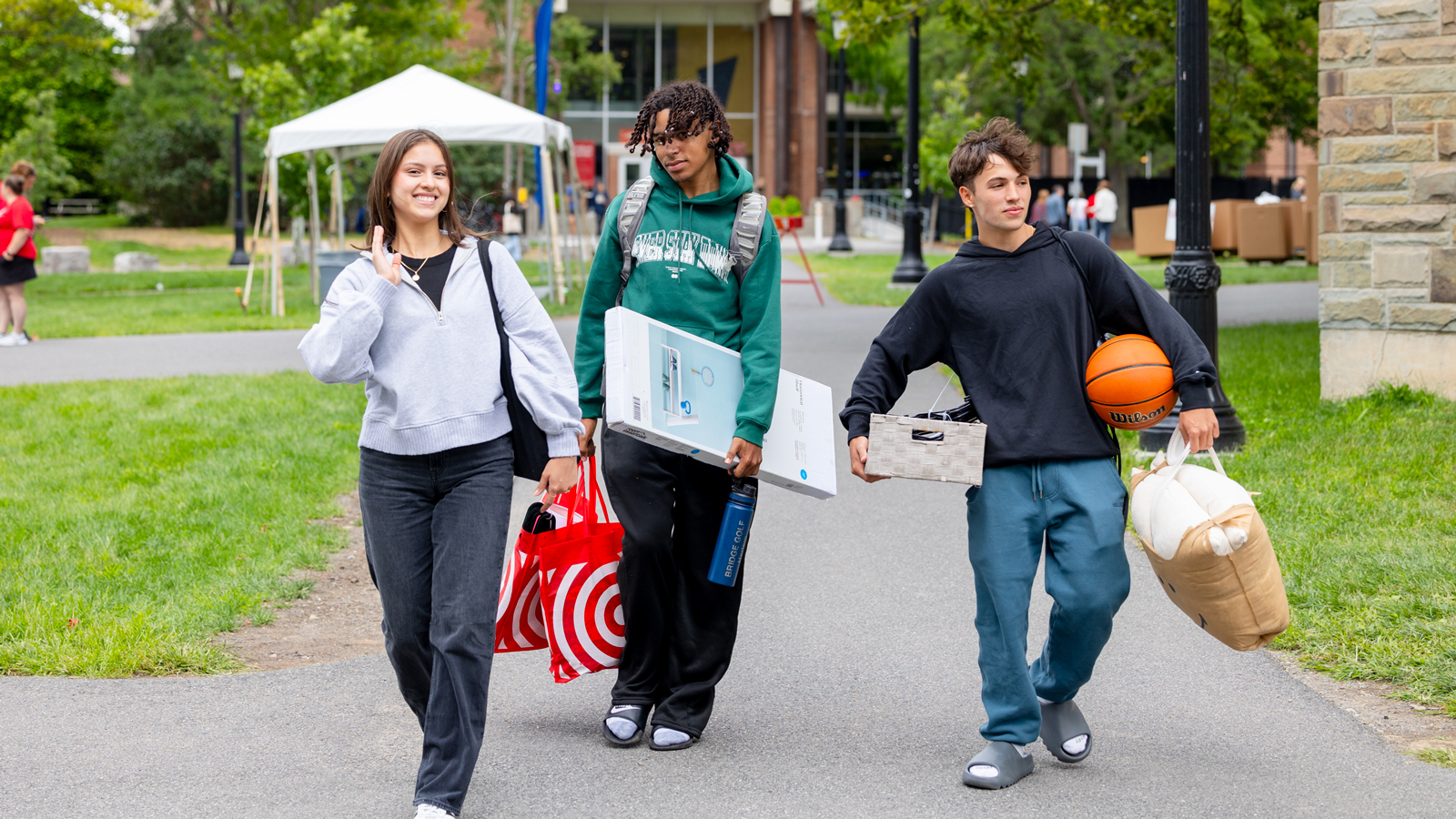 Students carry belongings on North Campus during Move-In 2024