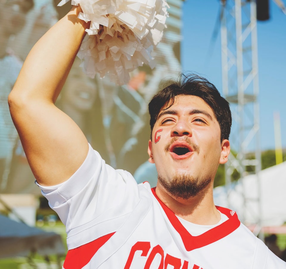 A male cheerleader at Convocation.