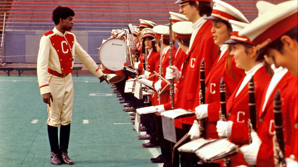members of the Big Red Band are arranged on a field during a practice, 1973
