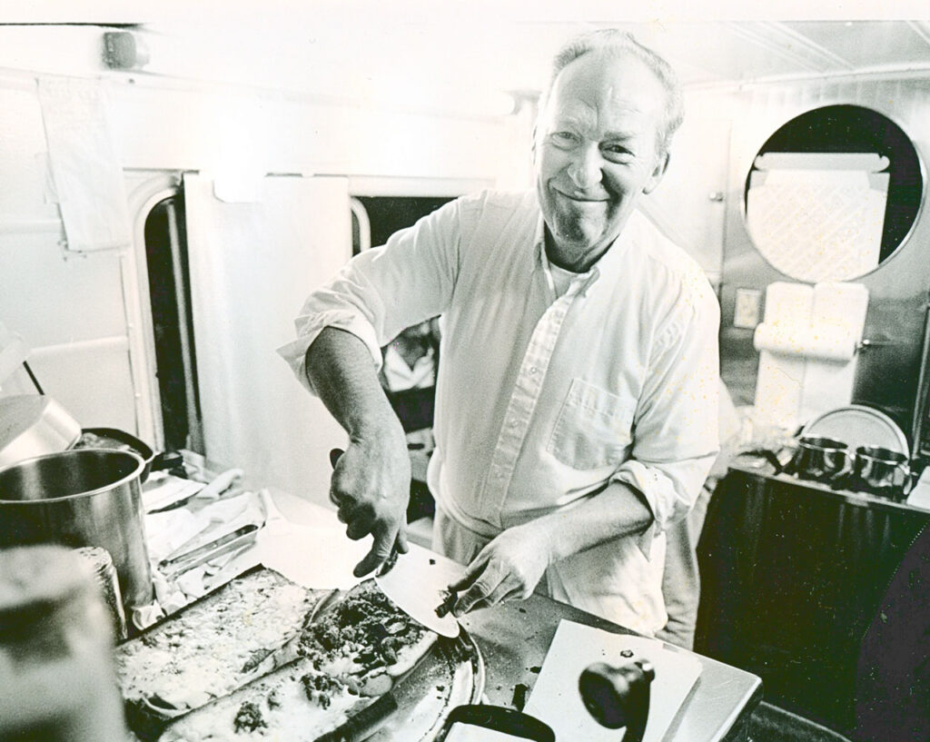 portrait of Bob Petrillose in the Hot Truck making pizza sandwiches