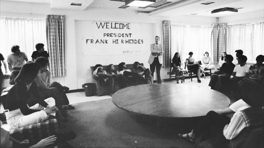 President Frank H.T. Rhodes attends a welcome event in a University Hall on West Campus, 1979